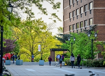 Students walking past building on campus