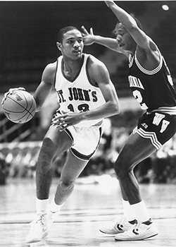 Black and white photo of Mark Jackson playing basketball