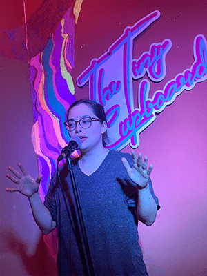 Katrina Reese Curato performing standup at the Flying Cupboard