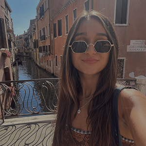 Alivia Caba wearing sunglasses taking a selfie