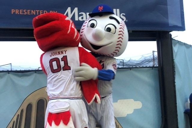 Johnny and Mr. Met embracing