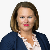 Headshot of Kristin Going wearing a white blouse and blue jacket.