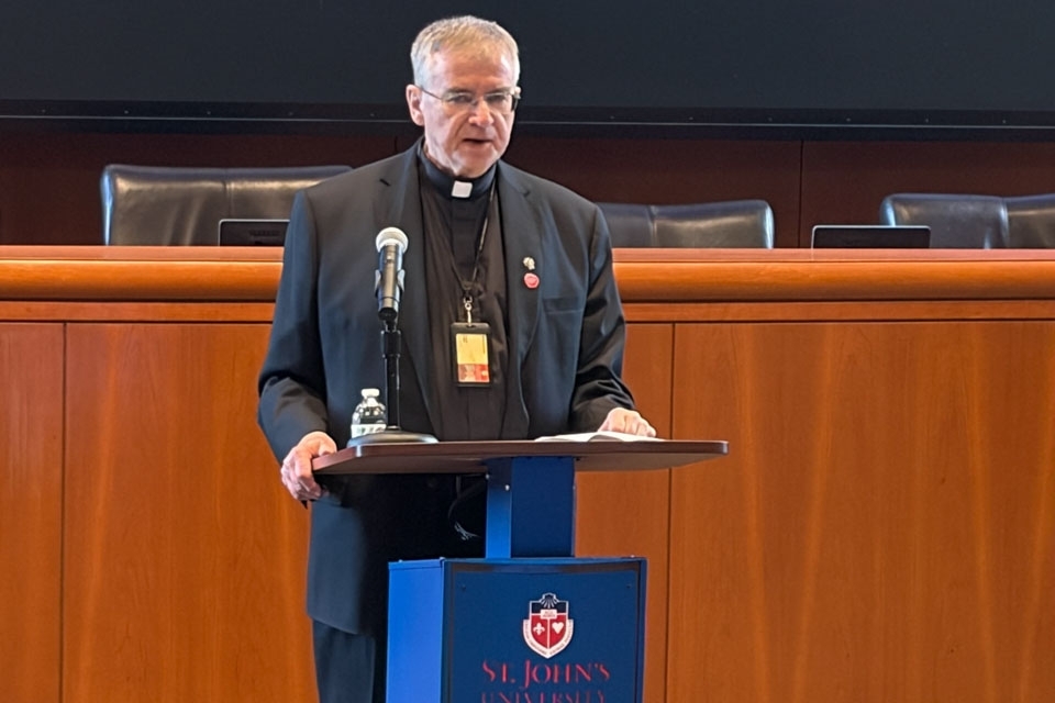Fr. Griffin speaking at podium